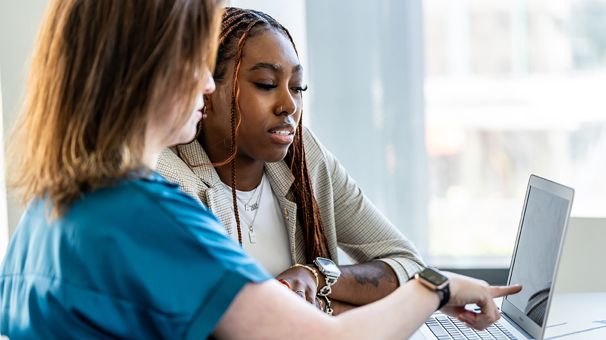 two women review options together during a one-on-one session