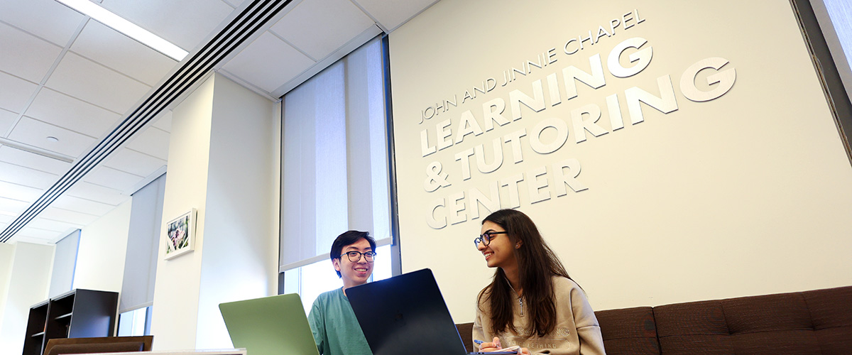 students working together inside of the John and Jinnie Chapel Learning & Tutoring Center