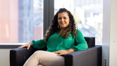 Headshot shot of Vanessa O'Brien, Accounting Department Manager sitting in chair in front of window