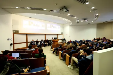 A panel speaks during a Societal Impact series event discussing the Sixers arena.