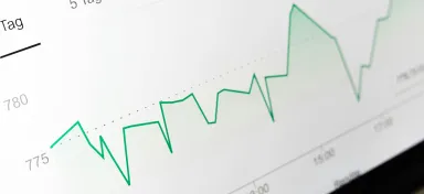 Financial performance shown in a line graph A green line against a white backdrop showing financial performance over time