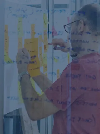 Student and Faculty Collaboration at a Glass Whiteboard
